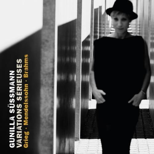 A black and white image of a woman in a hat on a CD cover.
