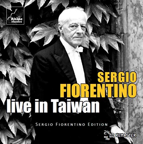 Black and white image of a man in a tuxedo, surrounded by foliage, on a CD cover.