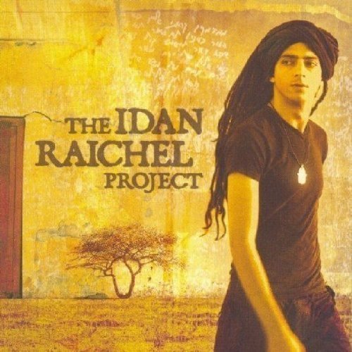 "Album cover featuring a man in a headscarf and dark shirt."