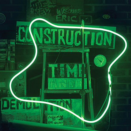 "Green neon outline of a guitar surrounds a sign that says 'Construction Time and Demolition'."