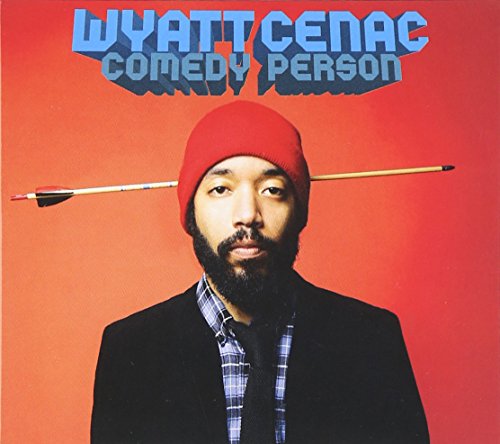 Man in red beanie and suit with an arrow behind his head.