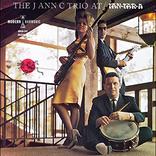CD cover featuring three musicians with bass, guitar, and drums.