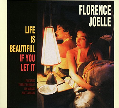 Vinyl album cover featuring two women in bed with a lit lamp.