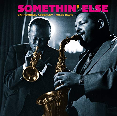 Cannonball Adderley and Miles Davis playing saxophones on album cover.