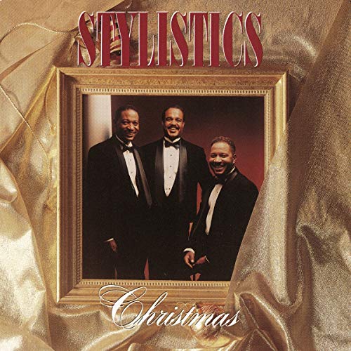 Stylistics Christmas album cover featuring three men in tuxedos within a frame.