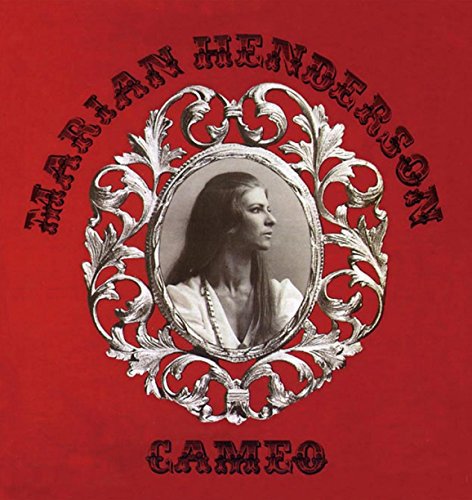 Red album cover with a silver ornate frame around a woman’s portrait.