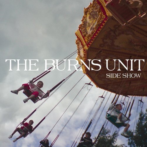 "Album cover: 'The Burns Unit Side Show' featuring a fairground swing ride."