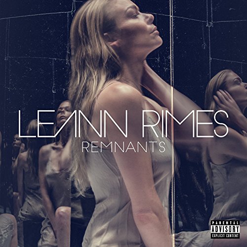 "Album cover with LeAnn Rimes in white dress, mirrored reflections, and 'parental advisory' label."