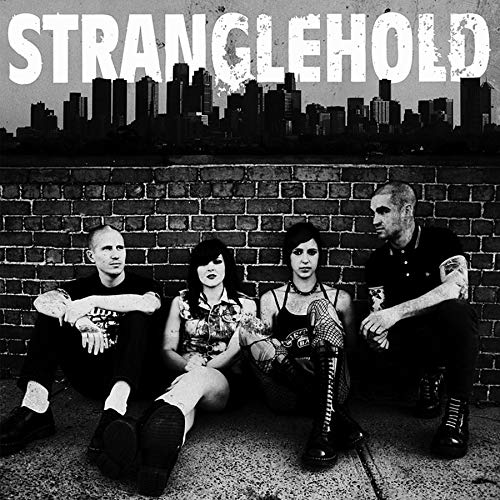 Black and white album cover featuring a band in front of a cityscape.