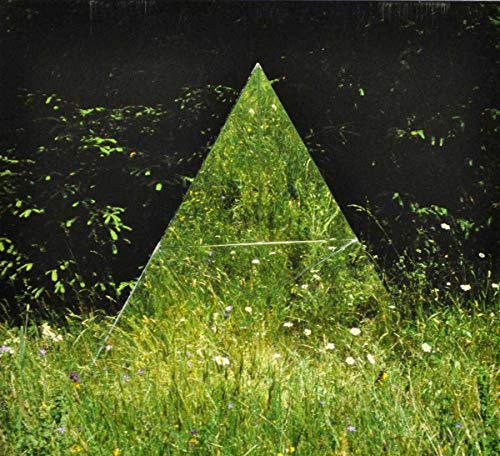 CD cover: a mirrored pyramid in a field of green grass.