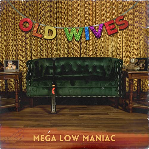 Album cover with green sofa, leopard print background, and colorful lettering.