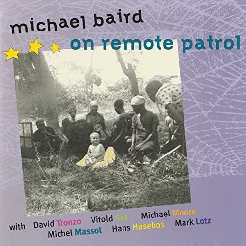CD cover: black and white photo of people in a grassy, wooded area.