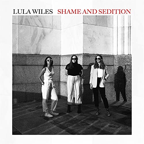 "Lula Wiles' album cover featuring three women standing against a marble wall."
