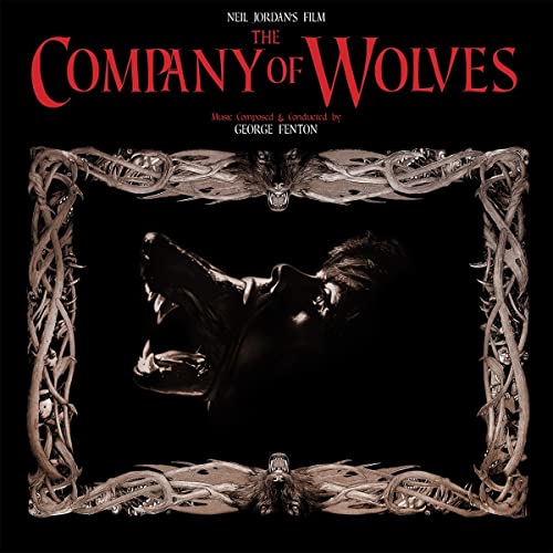 Black album cover for "The Company of Wolves" with wolf and ornate frame.