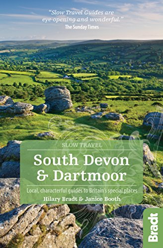 "Travel guide book cover with green landscape and rocky terrain, featuring title and authors."