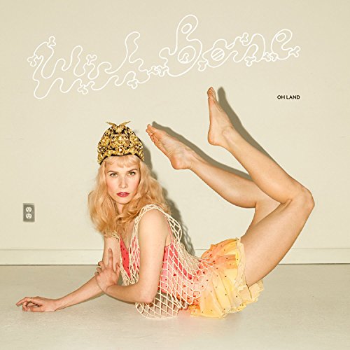 CD cover: woman in yellow, posing with a bent leg and headpiece.