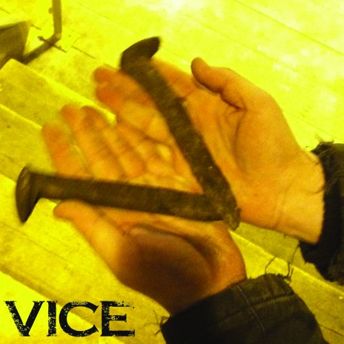 Hands holding rusty nails against a blurred yellow background, with "VICE" text.