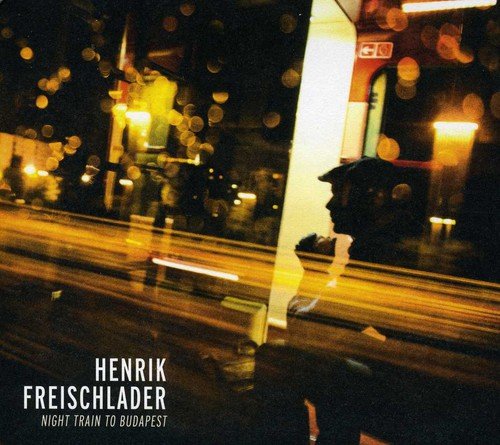 CD cover: blurred train exterior, man in silhouette, text "Henrik Freischlader".