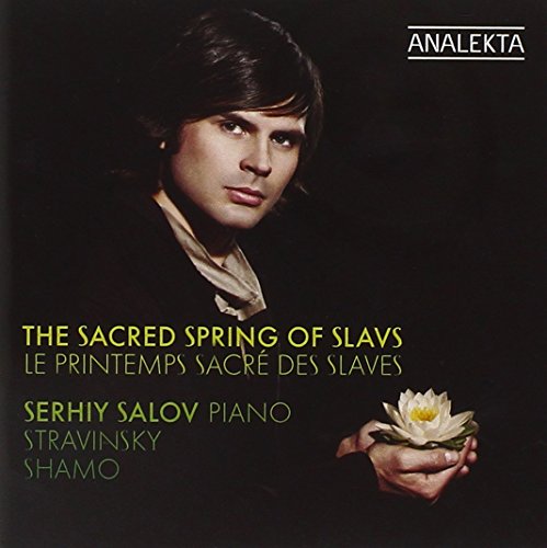 CD cover featuring a man holding a white flower against a dark background.