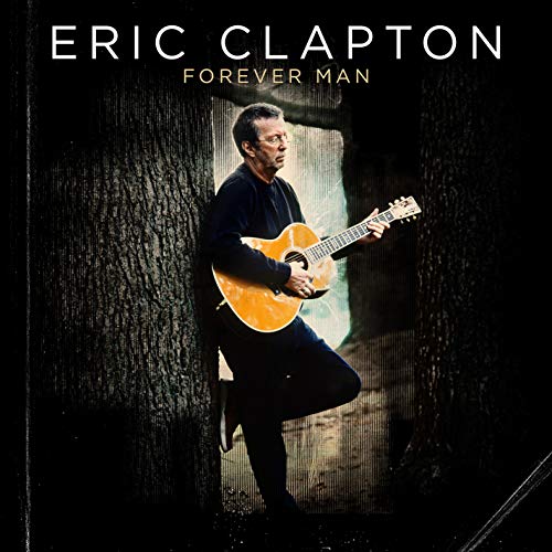 Eric Clapton holding a guitar leans against a tree on a CD cover.