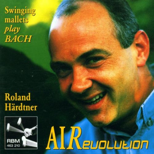 CD cover with a smiling man and yellow text "Swinging mallets play Bach" and "AIR evolution".