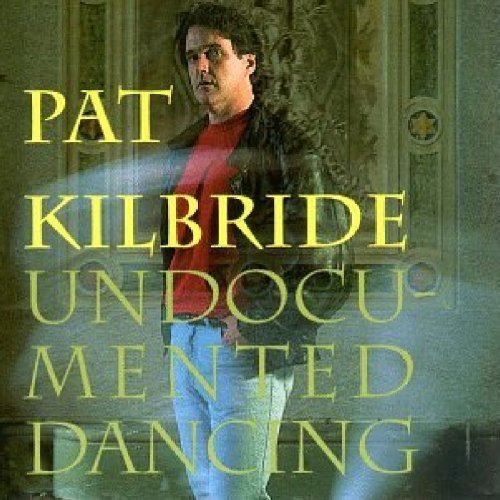 "CD cover with man in red shirt and black jacket, text 'Pat Kilbride Undocumented Dancing'."
