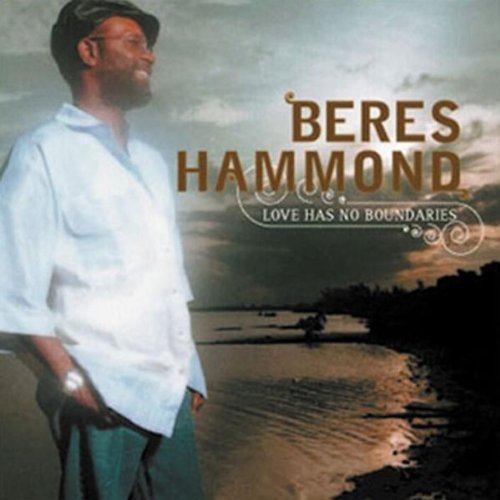 "Album cover with a man standing by water, cloudy sky, and artist's name."