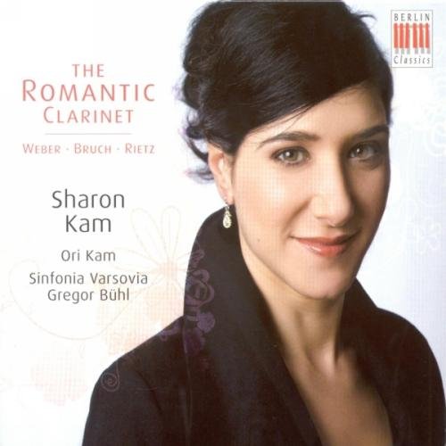 CD cover featuring a woman with dark hair and black top, floral background.