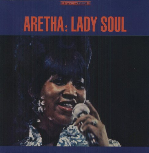 Aretha Franklin sings into a microphone, album cover with orange text on blue background.