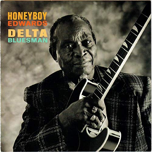David Honeyboy Edwards portrait with acoustic guitar, album cover.