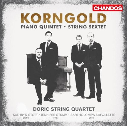 "CD cover with four men in suits and a piano, black and white image."