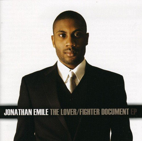 Man in a black suit and white shirt on album cover.