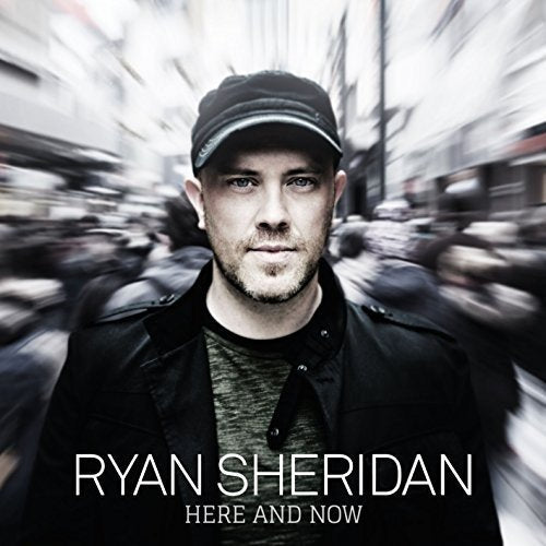 Album cover featuring Ryan Sheridan in a black jacket and cap, blurred city background.