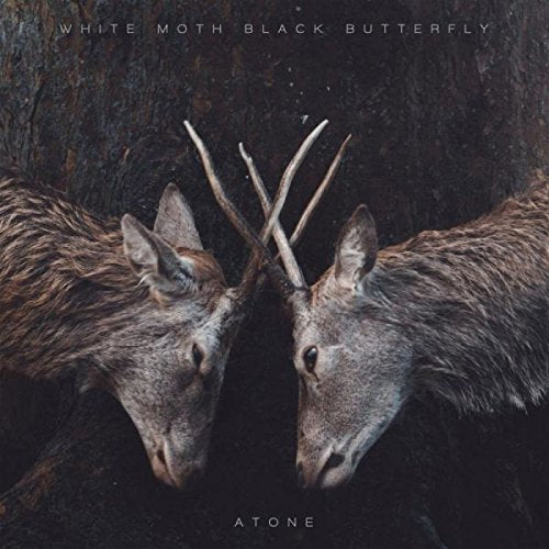 "Album cover featuring two deer heads with intertwined antlers against a dark background."