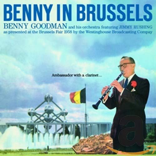 Benny Goodman playing the clarinet in front of the Atomium at the Brussels Fair.