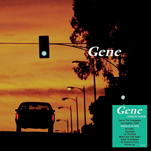 Vinyl album cover showing a car silhouette against a sunset with a teal sticker.