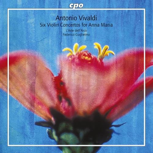 "CD cover with a pink flower on blue background, surrounded by a white square."