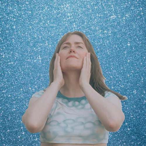 Woman with hands framing face, set against a sparkling blue background.