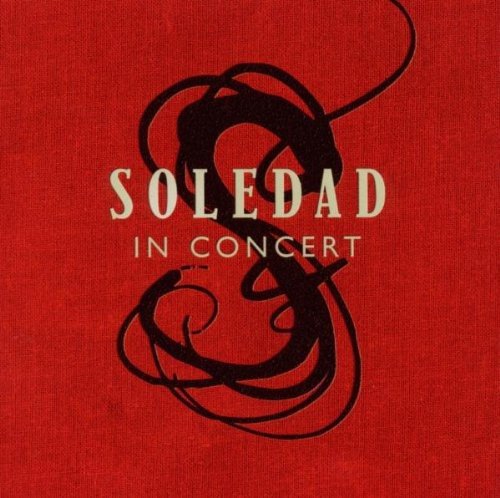 Red album cover with "Soledad in Concert" text and abstract black design.