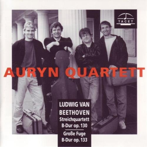 "CD cover with black and white photo of four men, text overlay."