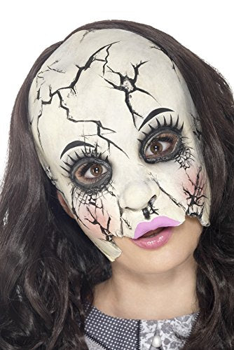 White cracked doll mask with brown eyes and pink lips worn by a brunette woman.