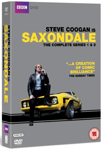 DVD case for "Saxondale" with man on yellow car, grey background.