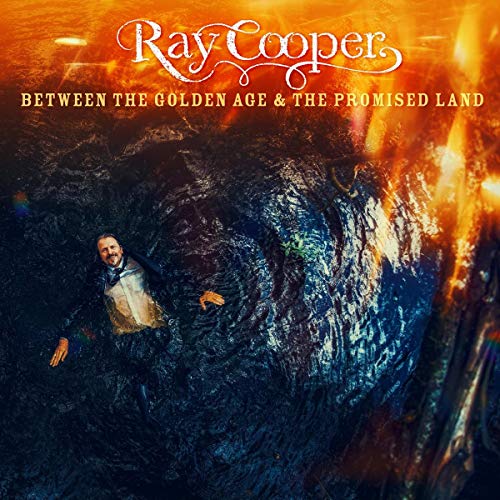 The vinyl album cover features a man emerging from dark, rocky terrain.