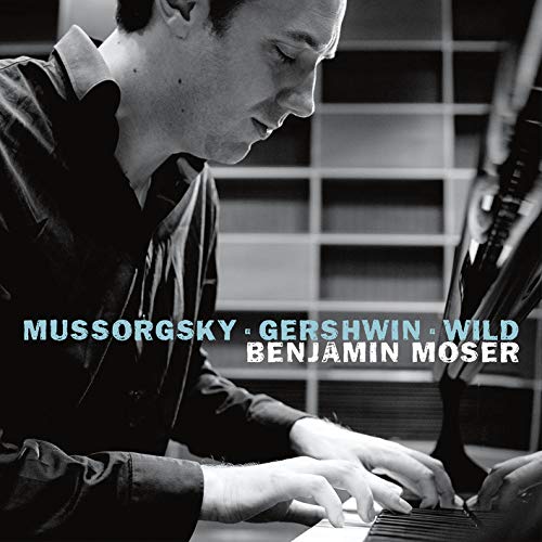 "CD cover featuring a black-and-white photo of a man playing piano."