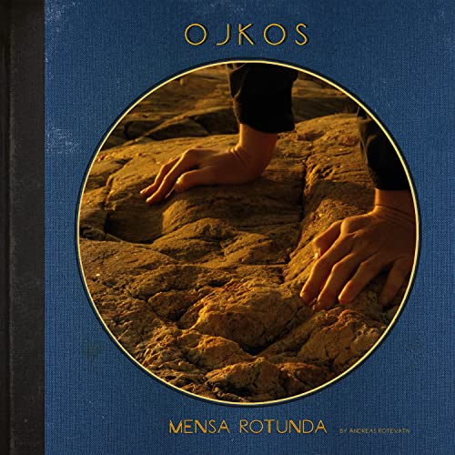CD cover: hands on textured rock surface within a circular frame.