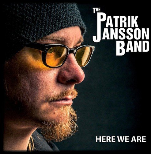 Close-up of Patrik Jansson wearing sunglasses and a knit cap.