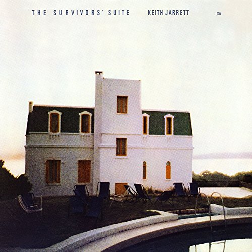 "Album cover featuring a white house with a pool and lounge chairs."