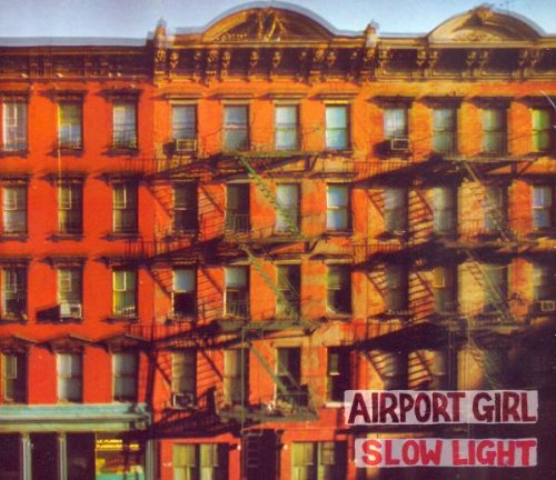 Red brick building facade with fire escapes and album title text.