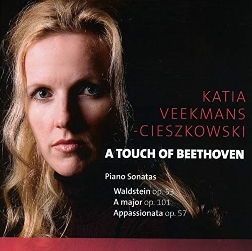 CD cover featuring a blonde woman against a black background with red and white text.