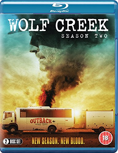 "Blu-ray case for 'Wolf Creek Season 2' with a man's profile and burning caravan."